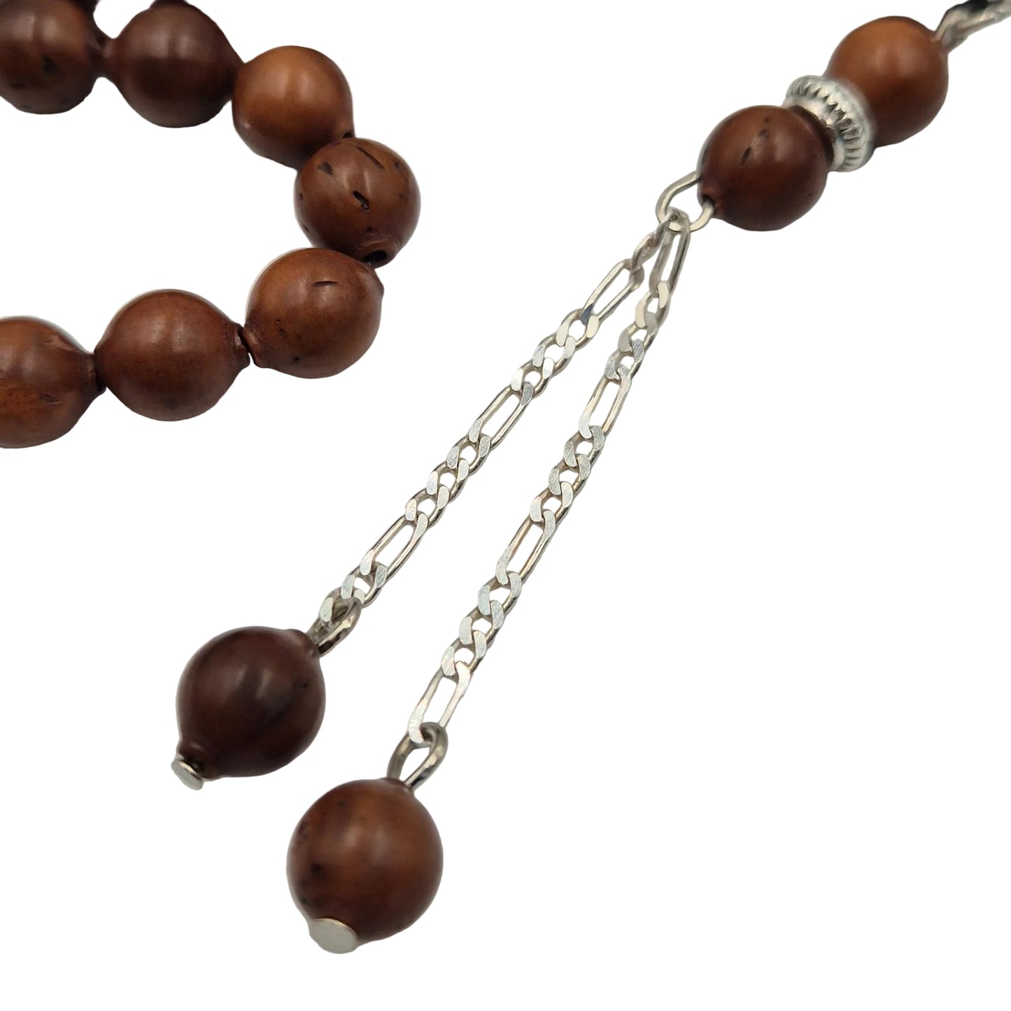 Nature’s resilience in your hand. Carved from the ultra-dense shell of the Narjil (Coconut) Fruit, these beads are renowned for their rugged durability and unique, earthy grain