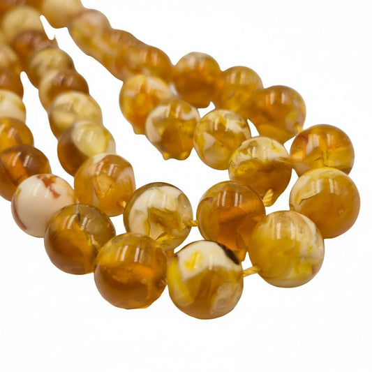 Compressed Miski misbaha, close detail of amber-toned beads — buy compressed miski beads UAE