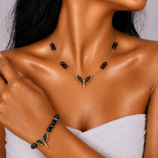 Black Agate gold-plated silver chain necklace and bracelet set, modelled on the wrist — black agate for protection