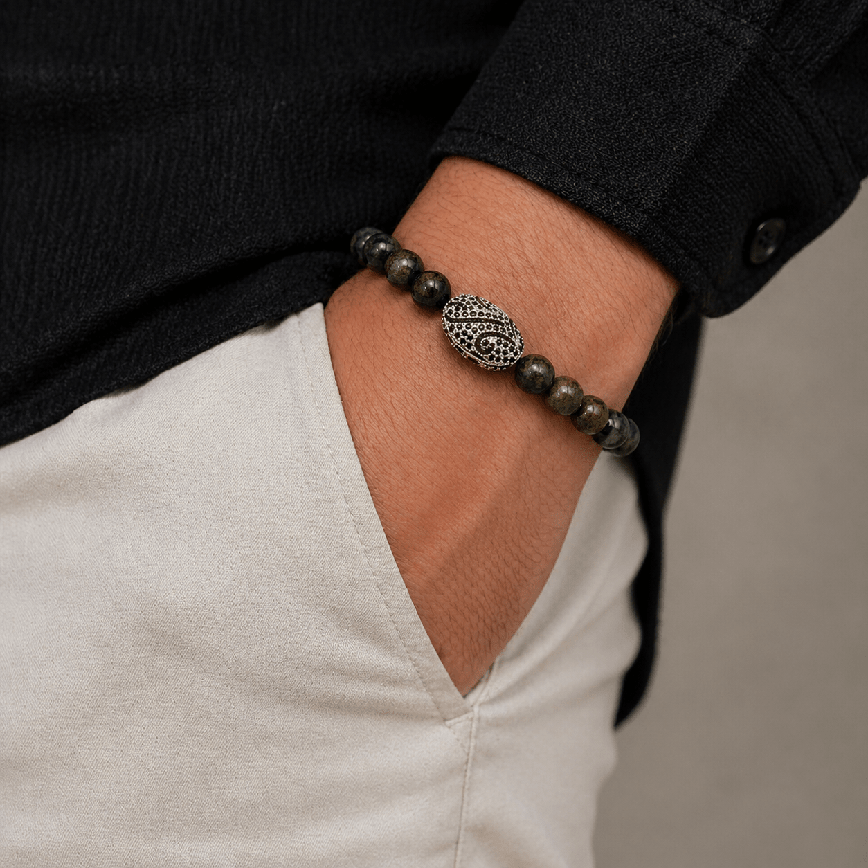 Bloodstone bracelet, modelled on the wrist — bloodstone for strength