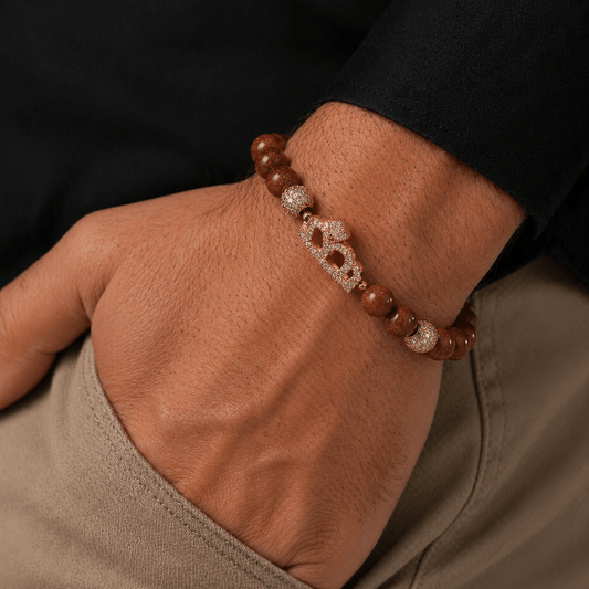 Brown Goldstone bracelet, modelled on the wrist — brown goldstone for ambition