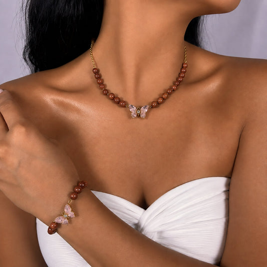 Brown Goldstone necklace and bracelet set, on the wrist beside the cuff — brown goldstone for ambition