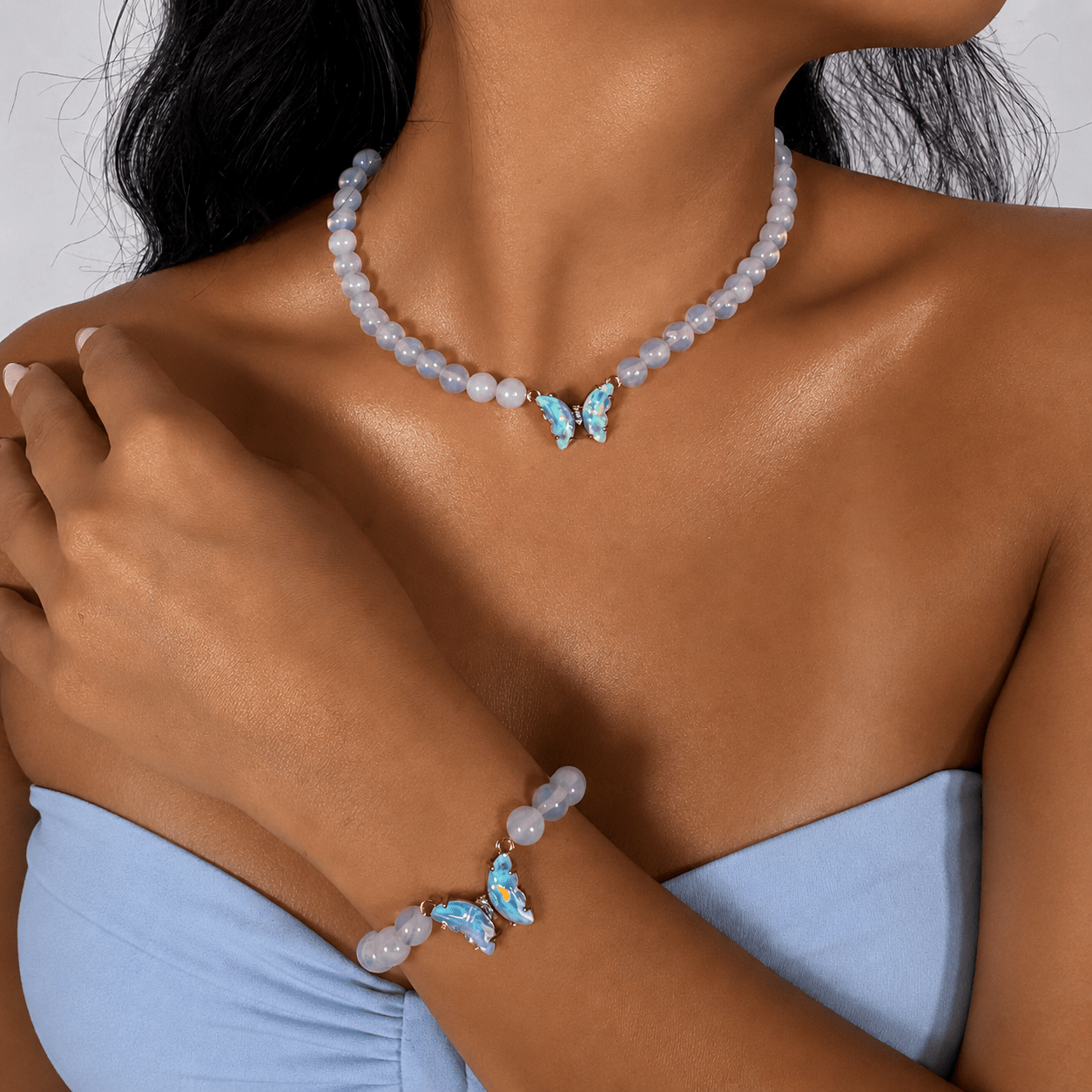 Moonstone necklace and bracelet set, shown on the wrist — moonstone for clarity