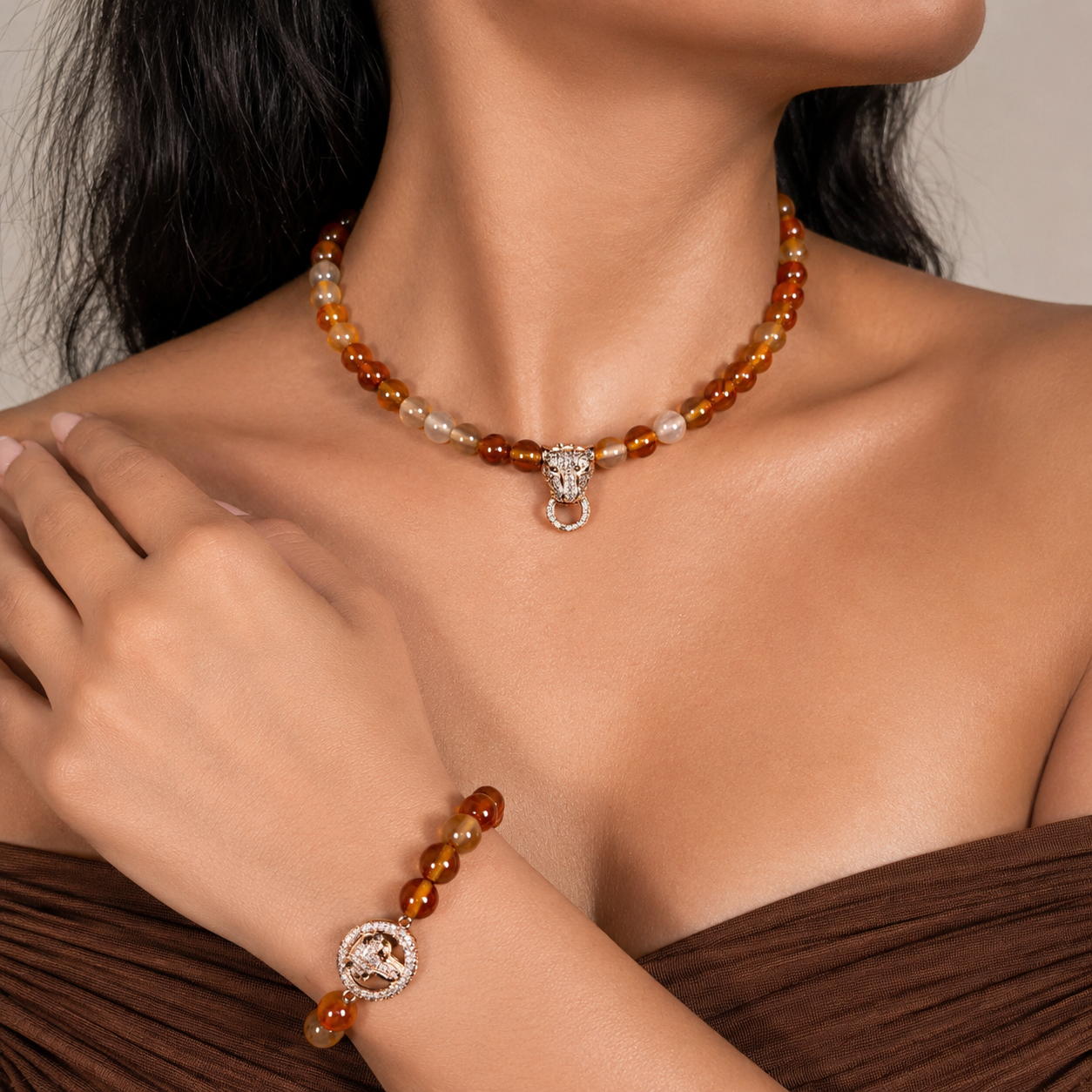 Orange Agate beaded gemstone necklace and bracelet set on white background