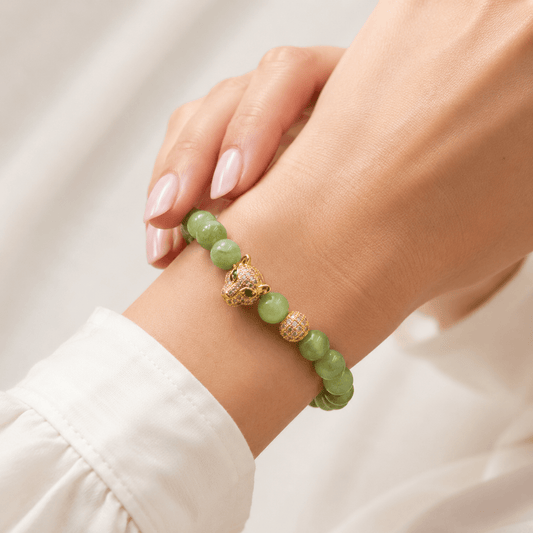 Jade bracelet, worn and shown from above — jade for wisdom