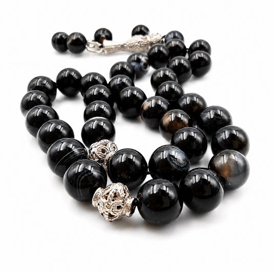Black Agate tasbih held in hand showing bead size — buy black agate beads UAE