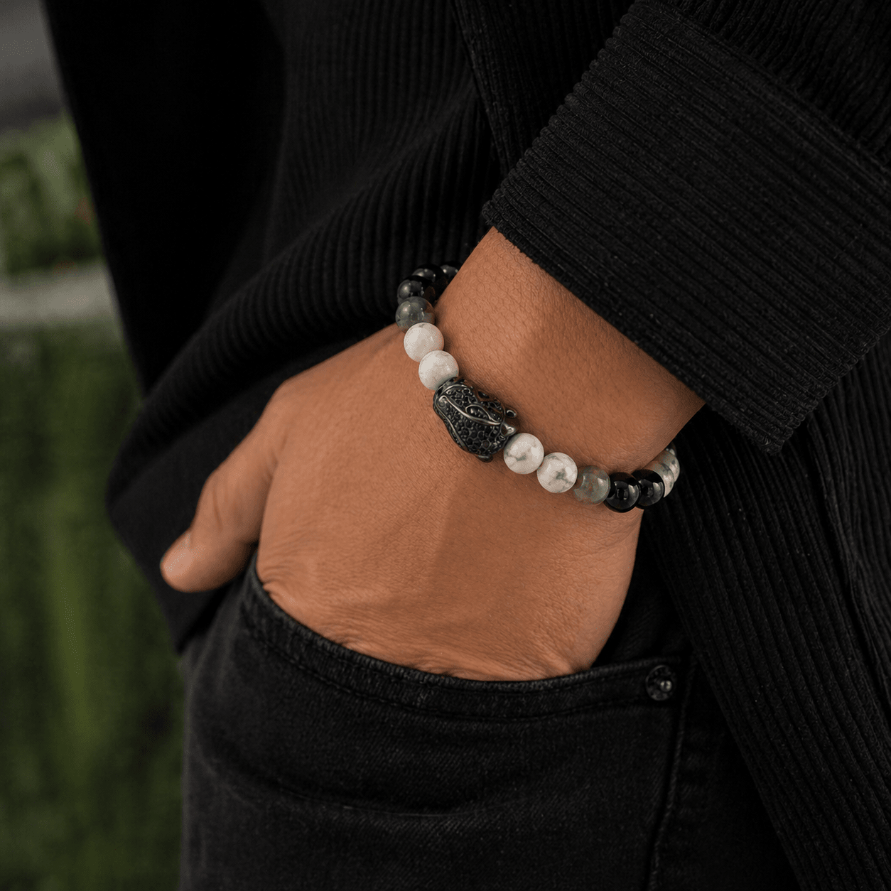 Black and White Agate bracelet, on the wrist against a neutral ground — black and white agate for grounding
