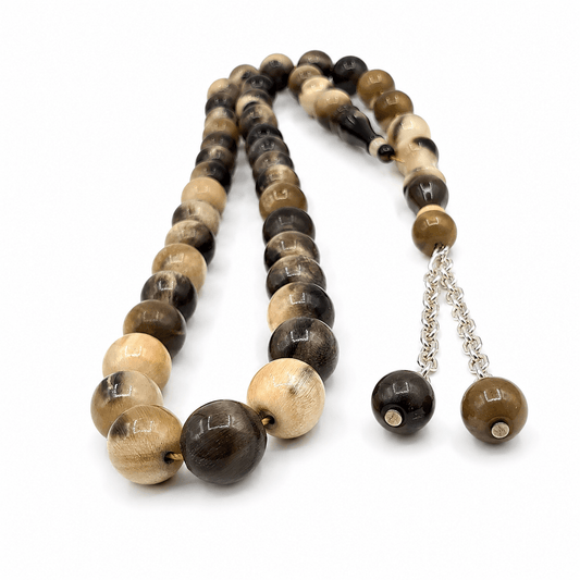 Organic Natural Horn masbaha, close detail of natural horn beads with a silver tassel — buy horn beads UAE