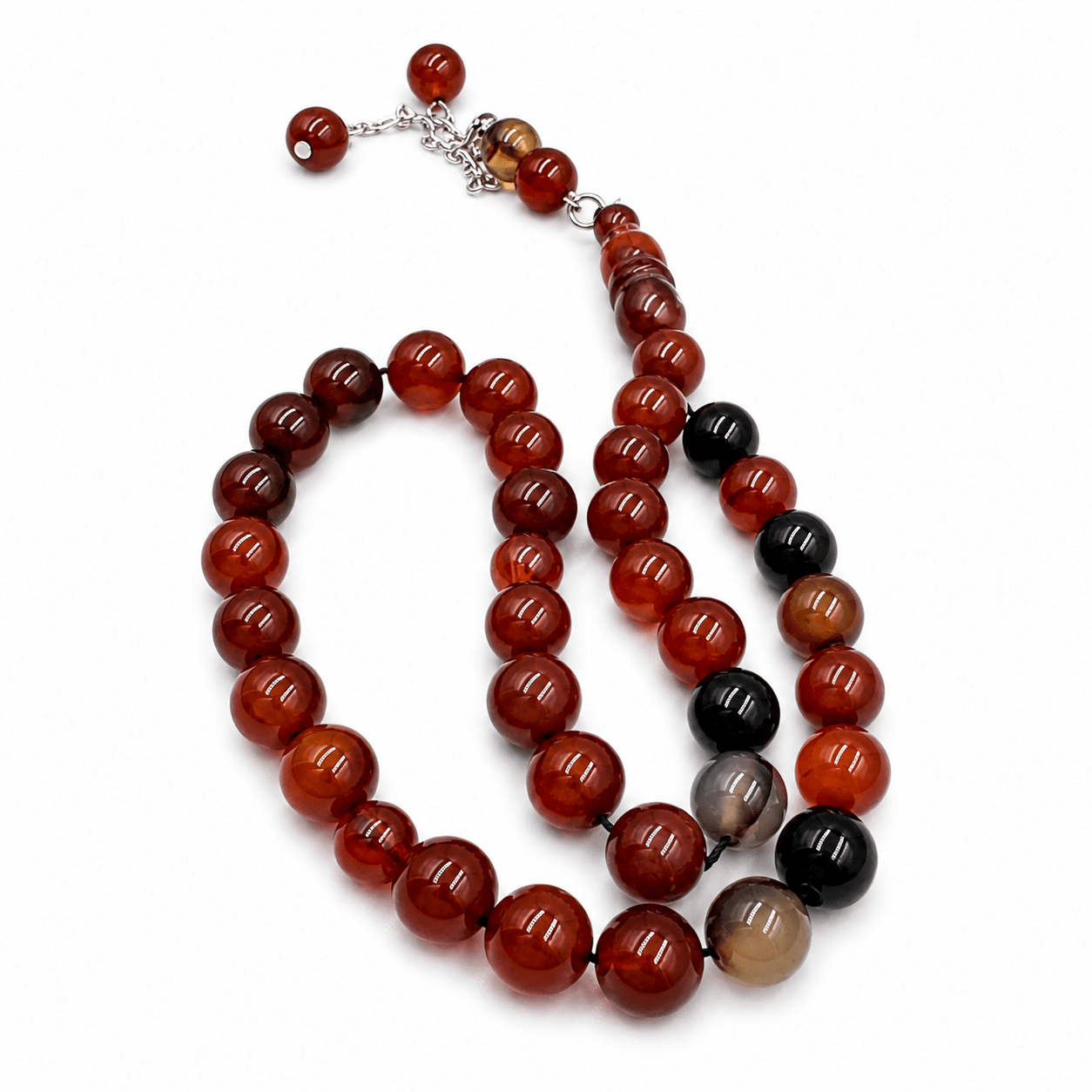 Flame Red Agate sebha, close-up of the tassel threads — red agate for vitality