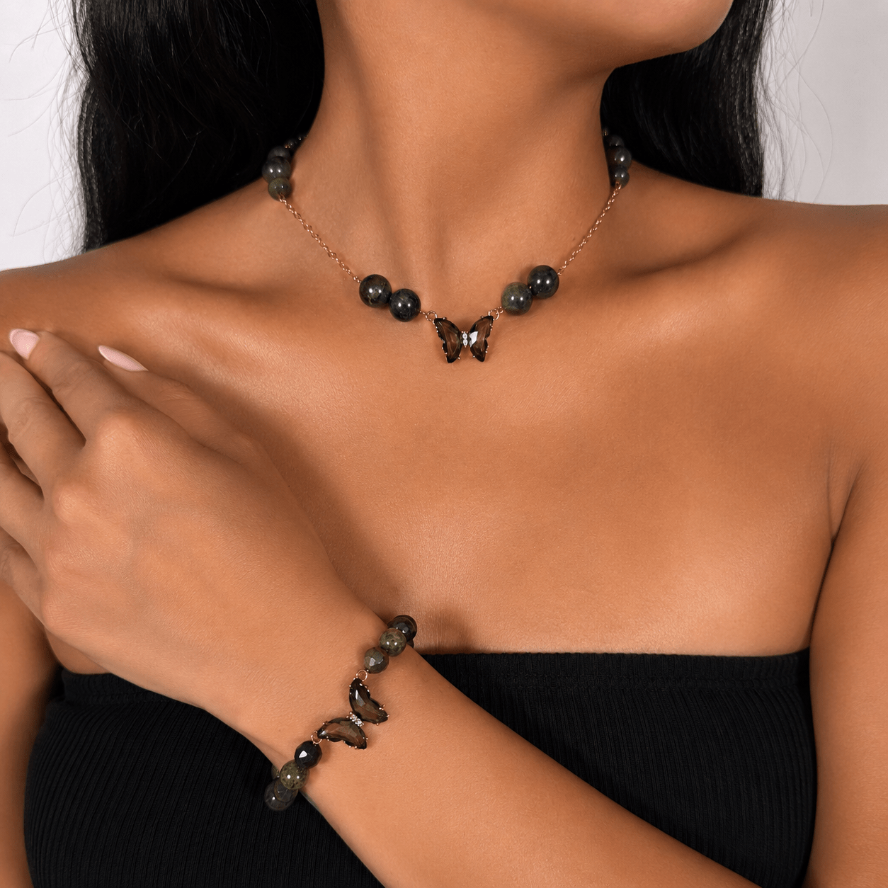 Bloodstone gold-plated silver chain necklace and bracelet set, shown on the wrist — bloodstone for courage