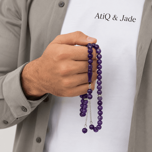 Royal Purple Amethyst tasbeeh held in hand showing bead size — buy royal purple amethyst beads UAE