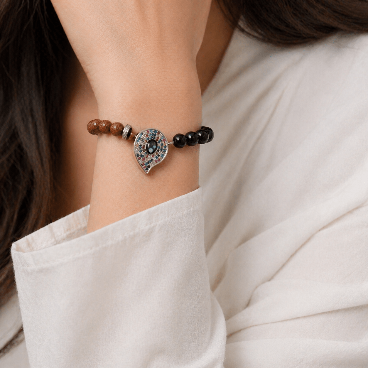 Green Goldstone bracelet, modelled on the wrist — green goldstone for healing