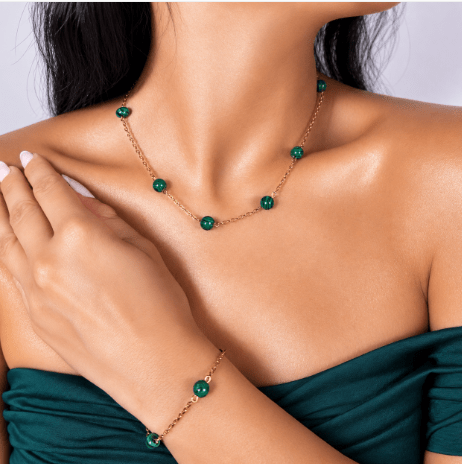 Malachite gold-plated silver chain necklace and bracelet set, on the wrist beside the cuff — buy malachite jewellery set UAE