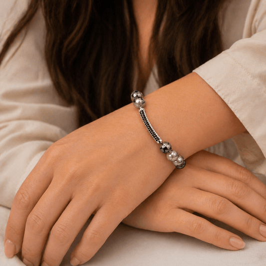 Stone Agate bracelet, on the wrist beside the cuff — stone agate for grounding