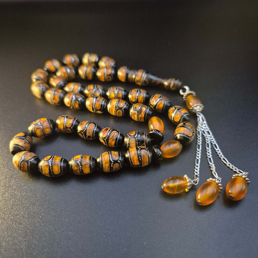 Kahraman Yusr tasbeeh, close detail of natural amber accents in silver inlay — buy yusur wood beads UAE