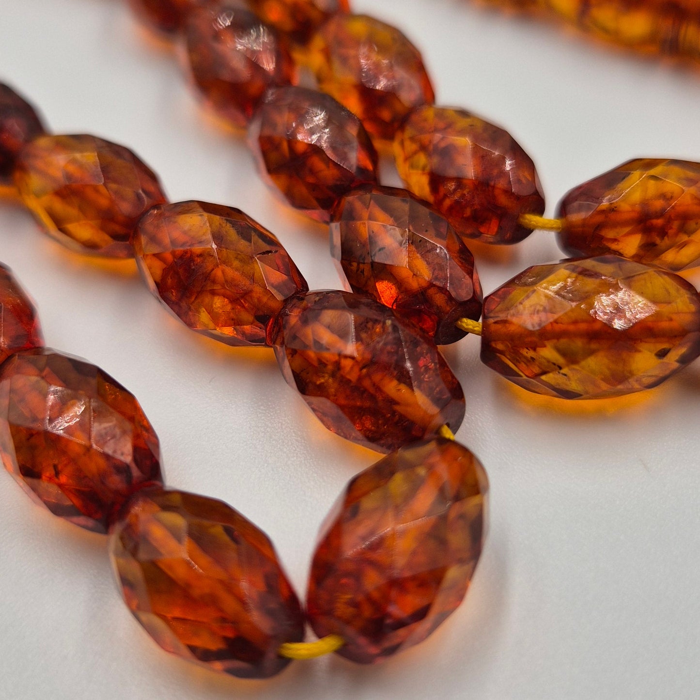 Close-up of amber-colored beaded tasbih - Kahraman