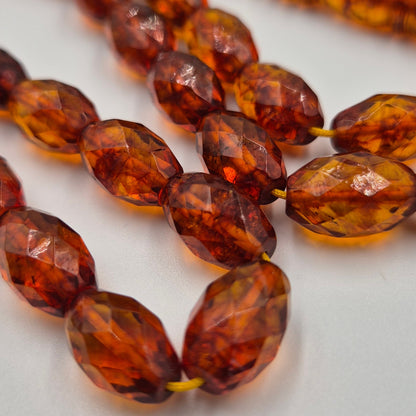 Close-up of amber-colored beaded tasbih - Kahraman