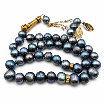 Black Pearl tasbeeh held in hand showing bead size — buy black pearl beads UAE