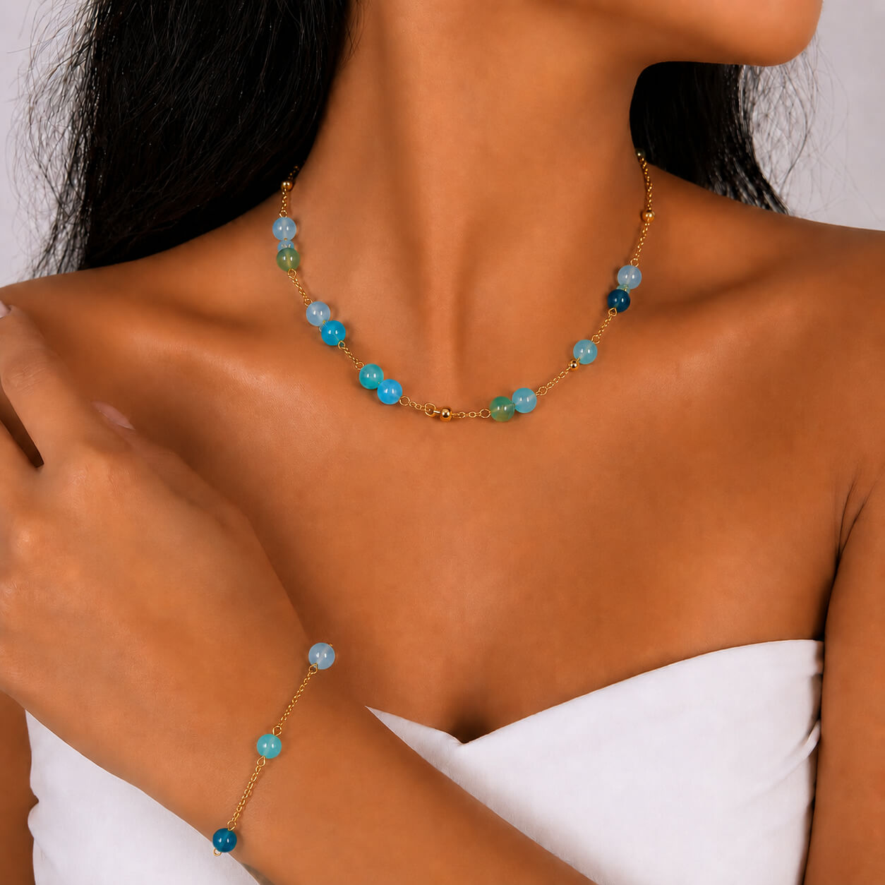 Blue Agate gold-plated silver chain necklace and bracelet set, worn and shown from above — blue agate for protection