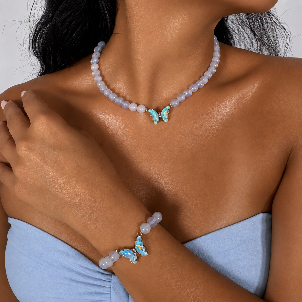  Moonstone white blue sheen beaded gemstone necklace and bracelet set on white background
