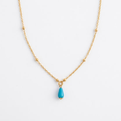 Silver gold-plated Fairouz teardrop necklace on a satellite chain, turquoise pendant on white — Fairouz necklace UAE