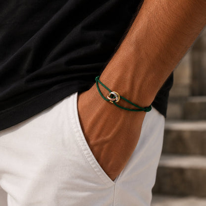 Trilogy Three-Ring adjustable cord bracelet, on the wrist against a neutral ground — buy cord bracelet UAE
