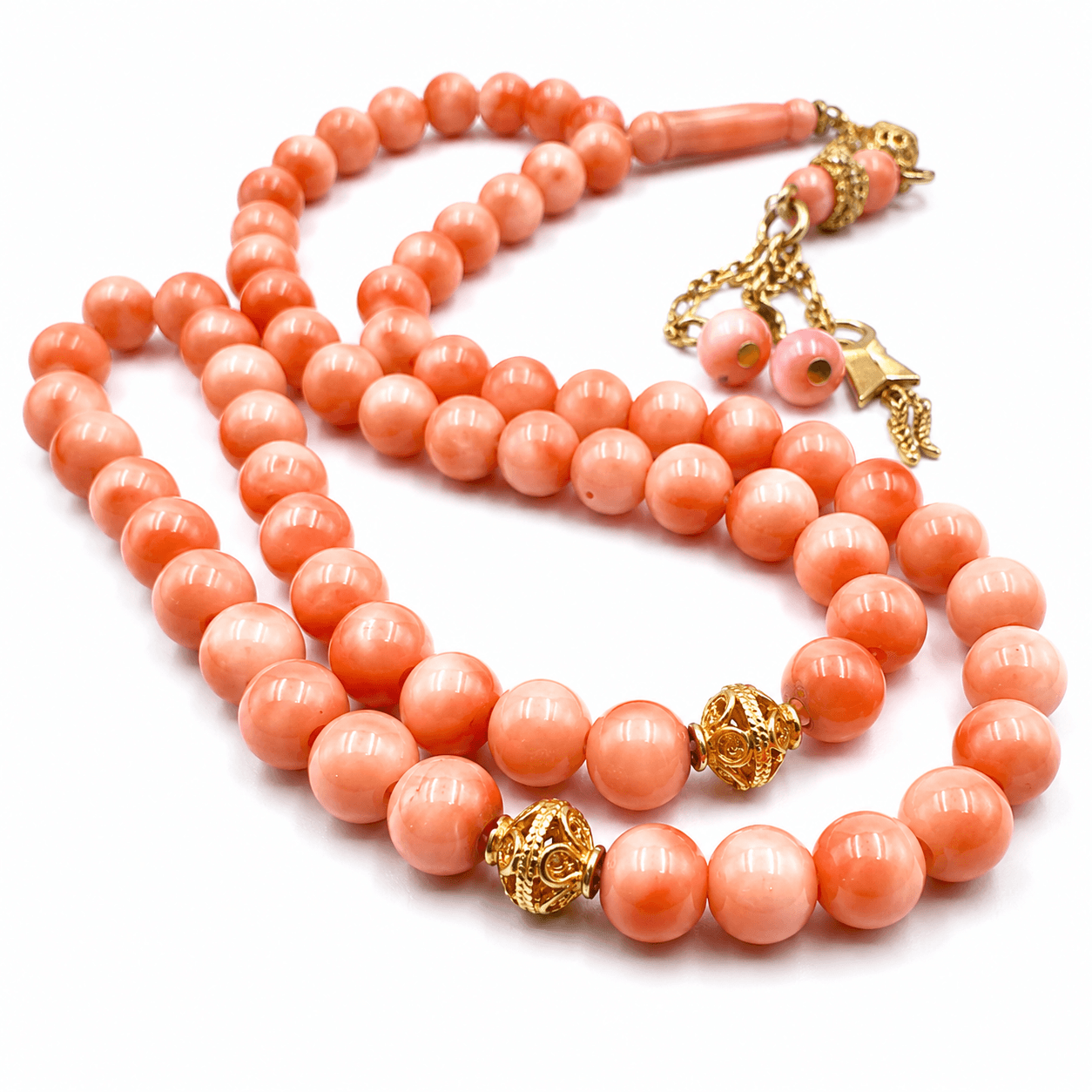 Angel Cheek Natural Coral masbaha, the tassel against the final bead — coral gemstone