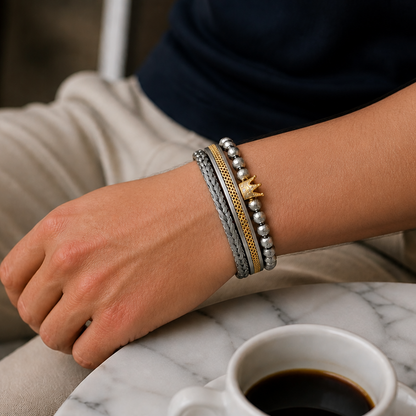 Three-piece men's crown bracelet stack. Rhodium-plated stainless steel. Ships across UAE in 1–2 days. Free delivery over 350 AED.