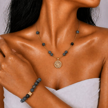 Volcanic Agate gold-plated silver chain necklace and bracelet set, modelled on the wrist — volcanic agate for protection