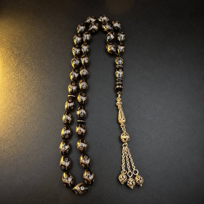 Trellis Yeser black coral mesbah, 33 beads inlaid with silver dot trellis and a three-coin silver tassel — buy yusur beads UAE