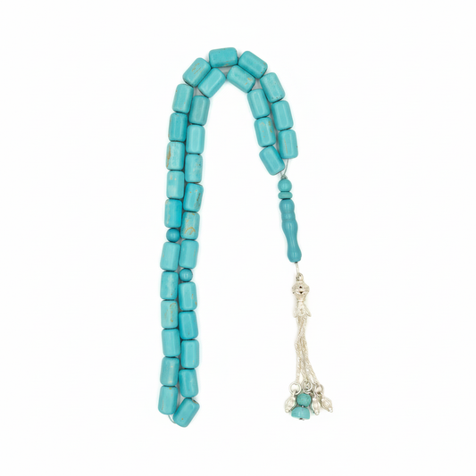 Captivating Azure Essence: A mesmerizing display of vibrant turquoise hues, reminiscent of deep ocean waters, evoking a sense of immediate calm and regal beauty crafted with golden copper and set of silver gold coated.

A celebrated talisman for those born in December, this Fairouz Mesbah resonates deeply with the Sagittarius spirit, offering a grounding energy that encourages truth and safeguards the traveler