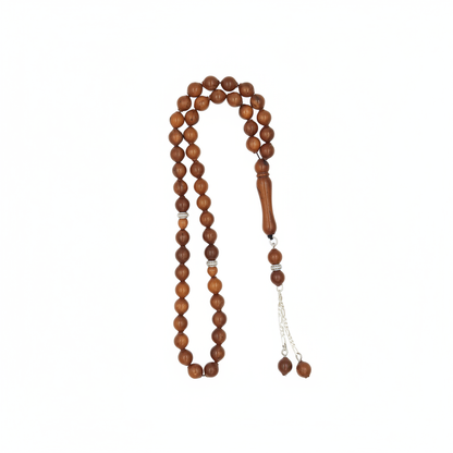 Nature’s resilience in your hand. Carved from the ultra-dense shell of the Narjil (Coconut) Fruit, these beads are renowned for their rugged durability and unique, earthy grain